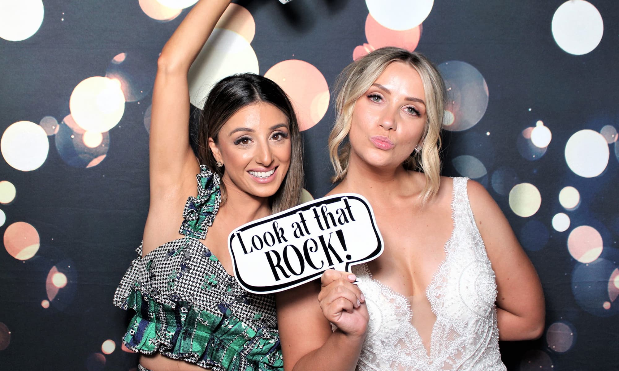 Wedding guests enjoying a photo booth experience at a Melbourne wedding